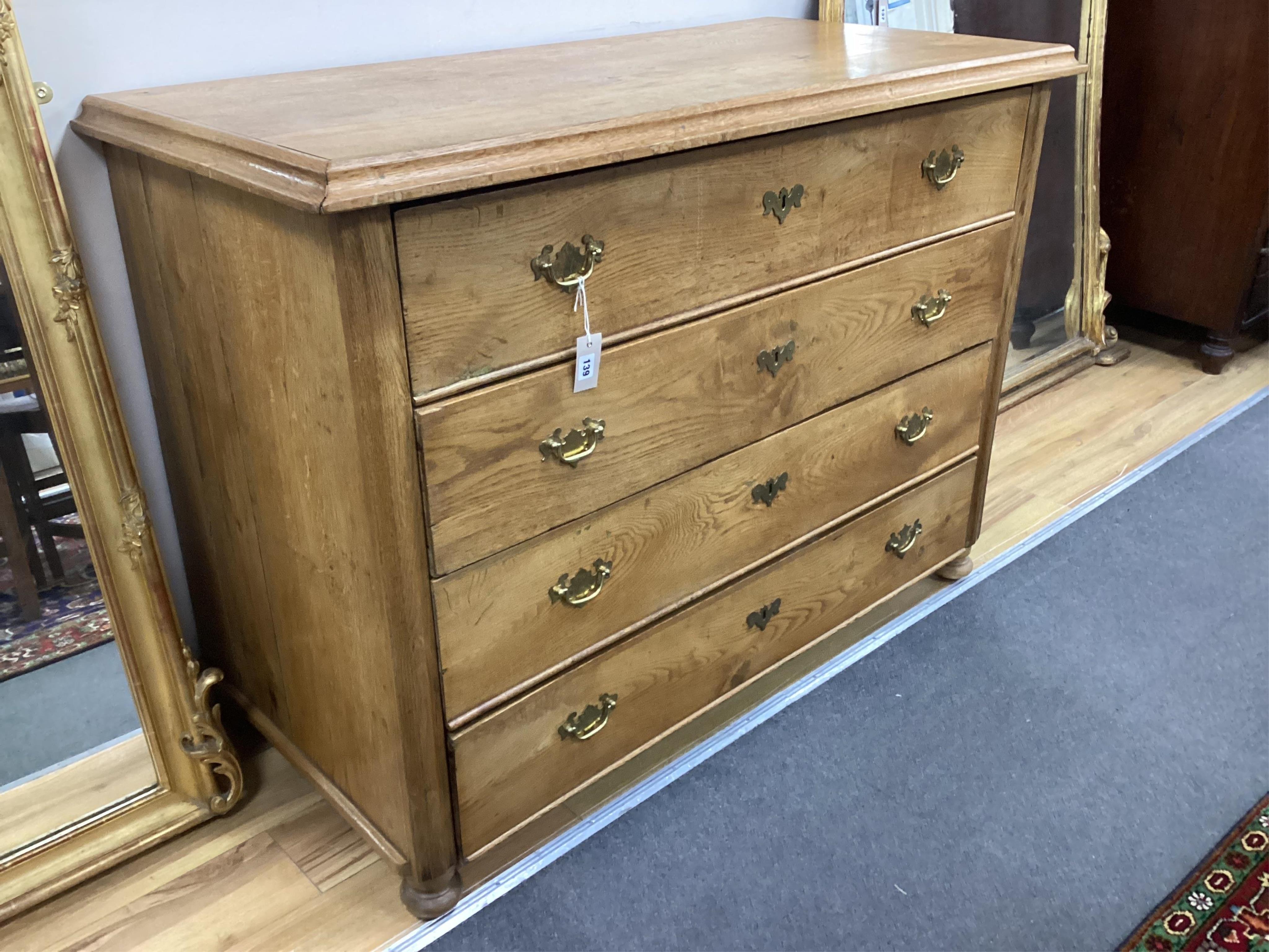 A large 19th century Continental oak chest of four drawers, width 134cm, depth 65cm, height 97cm. Condition - good, top water marked